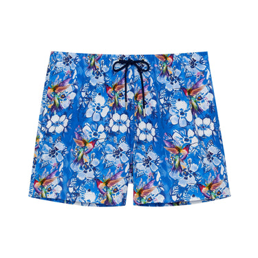 Blue floral and bird patterned shorts on a white background